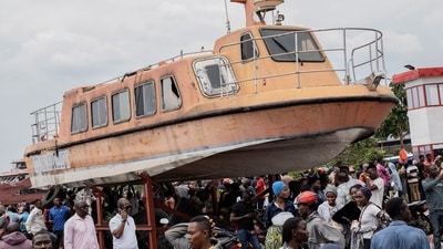 Residents gather to witness the search and rescue mission after a boat ferrying passengers and goods sank in Congo. (Reuters)