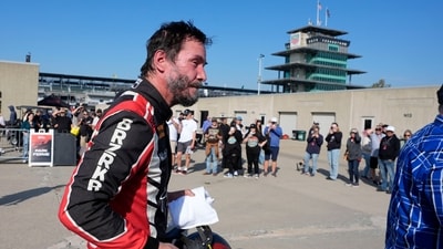 Keanu Reeves walks in the garage area following a GR Cup Series auto race at Indianapolis Motor Speedway, Saturday
(AP Photo/Darron Cummings) (AP) Keanu Reeves walks in the garage area following a GR Cup Series auto race at Indianapolis Motor Speedway, Saturday
(AP Photo/Darron Cummings) (AP)