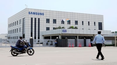 Samsung plant protests: A motorcyclist rides past Samsung company plant in Sriperumbudur, on the outskirts of Chennai. (AP) Samsung plant protests: A motorcyclist rides past Samsung company plant in Sriperumbudur, on the outskirts of Chennai. (AP)