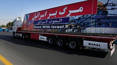 An anti-Israeli banner is carried on a truck during an annual Iranian armed forces parade. (AP) An anti-Israeli banner is carried on a truck during an annual Iranian armed forces parade. (AP)