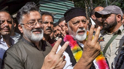 People's Conference leader and Shia cleric Imran Reza Ansari (L) shows victory sign. (PTI) People's Conference leader and Shia cleric Imran Reza Ansari (L) shows victory sign. (PTI)
