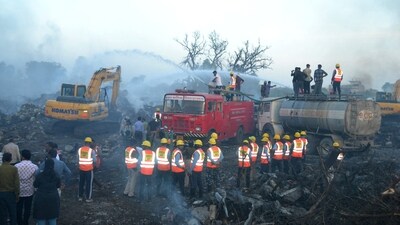 Rescue members from State Disaster Response Force (SDRF) douse the smoldering debris following a blast in a firecracker factory in Harda, Madhya Pradesh. (REUTERS) Rescue members from State Disaster Response Force (SDRF) douse the smoldering debris following a blast in a firecracker factory in Harda, Madhya Pradesh. (REUTERS)