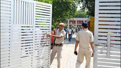 Security personnel guard outside the EVM strong room at the Government Girls College in Sector 14 counting centre on Sunday. (Parveen Kumar/HT Photo) Security personnel guard outside the EVM strong room at the Government Girls College in Sector 14 counting centre on Sunday. (Parveen Kumar/HT Photo)