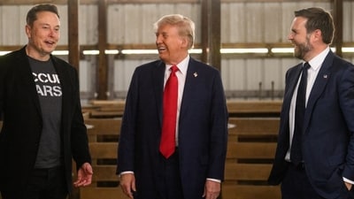 Former US President Donald Trump, center, and Senator JD Vance, right, a Republican from Ohio and Republican vice-presidential nominee, greet Elon Musk, chief executive officer of Tesla Inc., backstage prior to a campaign event at the Butler Farm Show in Butler, Pennsylvania, US, on Saturday, Oct. 5, 2024. Elon Musk will campaign with the former president on Saturday, joining a rally at the scene of a summer assassination attempt and cementing his role as one of the Republican candidate's key backers. Photographer: Justin Merriman/Bloomberg (Bloomberg)