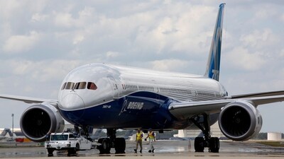 Boeing employees walk the new Boeing 787-10 Dreamliner down towards the delivery ramp area at the company's facility. (AP)