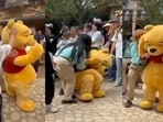 Winnie the Pooh mascot collapses after being hit on head by tourist at Shanghai Disneyland.
