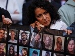 A woman reacts as she takes part in a march towards Israeli Prime Minister Benjamin Netanyahu's private residence, to mark one year since the deadly October 7 attack by Hamas, in Jerusalem, October 7, 2024.