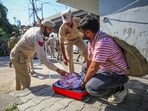 Jammu: Security personnel check luggage of a commuter outside a counting centre, a day before the counting of votes for Jammu & Kashmir Assembly elections, in Jammu, Monday, Oct. 7, 2024.