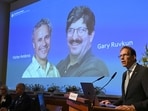 Nobel Committee secretary general Thomas Perlmann speaks to the media in front of a picture of this year's laureates Victor Ambros and Gary Ruvkum during the announcement of the winners of the 2024 Nobel Prize in Physiology or Medicine at the Karolinska Institute in Stockholm on October 7, 2024. 