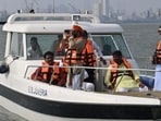 Sambhajiraje, who once was a BJP Rajya Sabha MP, attempted to inspect the proposed site by going into the Arabian Sea. Since boats are not allowed there, he used binoculars to see if any work was in progress. (Anshuman Poyrekar/ Hindustan Times)