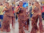 A woman danced in a metro to 'Billo Rani,' sparking outrage and mixed reactions online. A woman danced in a metro to 'Billo Rani,' sparking outrage and mixed reactions online.
