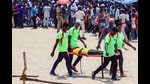 Chennai, Oct 06 (ANI): Tamilnadu Fire and Rescue Service personnel evacuate a teen after he fainted due to heat during the Indian Air Force (IAF) airshow as part of the 92nd anniversary celebrations of IAF, at Marina Beach in Chennai on Sunday. (ANI Photo) (Lakshmi)