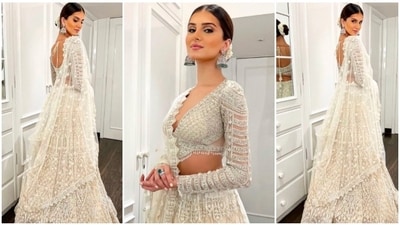 Tara Sutaria looked like a vision in this embellished lehenga set by Falguni and Shane Peacock. Adorned with intricate sequin embroidery and tassel detailing, her outfit is a true work of art, (Instagram/@tarasutaria) Tara Sutaria looked like a vision in this embellished lehenga set by Falguni and Shane Peacock. Adorned with intricate sequin embroidery and tassel detailing, her outfit is a true work of art, (Instagram/@tarasutaria)