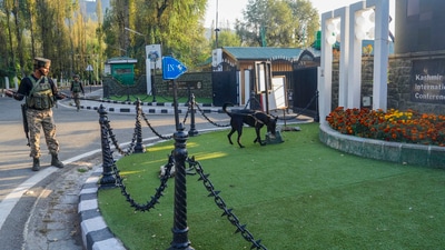 A security personnel checks the area around Sher-i-Kashmir International Convention Centre (SKICC), a counting centre for Jammu & Kashmir Assembly elections, a day before the election results, in Srinagar, on Monday. (PTI) A security personnel checks the area around Sher-i-Kashmir International Convention Centre (SKICC), a counting centre for Jammu & Kashmir Assembly elections, a day before the election results, in Srinagar, on Monday. (PTI)