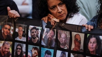 A woman reacts as she takes part in a march towards Israeli Prime Minister Benjamin Netanyahu's private residence, to mark one year since the deadly October 7 attack by Hamas, in Jerusalem, October 7, 2024. (REUTERS)