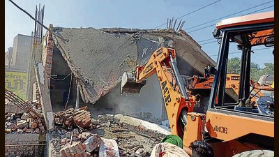 MC demolishes an illegal construction at Transport Nagar in Ludhiana on Monday. (HT Photo)
