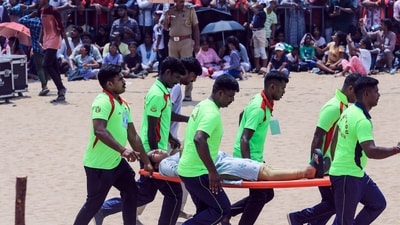 Tamilnadu Fire and Rescue Service personnel evacuate a woman after she fainted due to heat during the Indian Air Force (IAF) airshow as part of the 92nd anniversary celebrations of IAF, at Marina Beach in Chennai on Sunday. (Lakshmi) Tamilnadu Fire and Rescue Service personnel evacuate a woman after she fainted due to heat during the Indian Air Force (IAF) airshow as part of the 92nd anniversary celebrations of IAF, at Marina Beach in Chennai on Sunday. (Lakshmi)