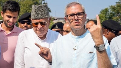 Srinagar: Jammu and Kashmir National Conference (JKNC) President Farooq Abdullah and Vice President Omar Abdullah show their fingers marked with indelible ink after casting vote during the second phase of Jammu and Kashmir Assembly elections, in Srinagar, Wednesday, Sept. 25, 2024. (PTI Photo/S Irfan) Srinagar: Jammu and Kashmir National Conference (JKNC) President Farooq Abdullah and Vice President Omar Abdullah show their fingers marked with indelible ink after casting vote during the second phase of Jammu and Kashmir Assembly elections, in Srinagar, Wednesday, Sept. 25, 2024. (PTI Photo/S Irfan)