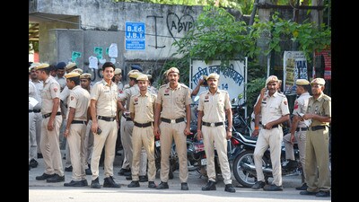 Security personnel stand guard outside a strongroom ahead of the counting of votes, in Gurugram on Monday. (Parveen Kumar/HT) Security personnel stand guard outside a strongroom ahead of the counting of votes, in Gurugram on Monday. (Parveen Kumar/HT)