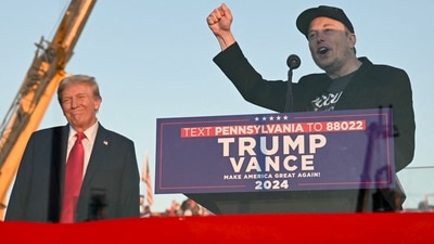 Tesla CEO Elon Musk (R) speaks on stage as he joins former US President and Republican presidential candidate Donald Trump during a campaign rally at site of his first assassination attempt in Butler, Pennsylvania on October 5, 2024. (Photo by Jim WATSON / AFP) (AFP) Tesla CEO Elon Musk (R) speaks on stage as he joins former US President and Republican presidential candidate Donald Trump during a campaign rally at site of his first assassination attempt in Butler, Pennsylvania on October 5, 2024. (Photo by Jim WATSON / AFP) (AFP)