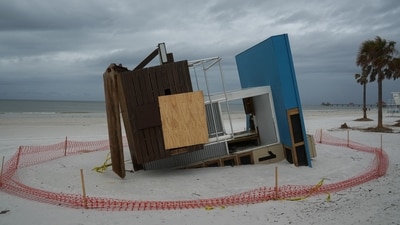 A collapsed lifeguard tower as a result of Hurricane Helene is seen in Clearwater, Florida ahead of Hurricane Milton's expected mid-week landfall, on October 6, 2024.
The National Hurricane Center (NHC) said the new storm, Milton, had intensified into a Category 1 hurricane Sunday with maximum sustained winds of 80 miles (130 kilometers) an hour. (Photo by Bryan R. SMITH / AFP) (AFP) A collapsed lifeguard tower as a result of Hurricane Helene is seen in Clearwater, Florida ahead of Hurricane Milton's expected mid-week landfall, on October 6, 2024.
The National Hurricane Center (NHC) said the new storm, Milton, had intensified into a Category 1 hurricane Sunday with maximum sustained winds of 80 miles (130 kilometers) an hour. (Photo by Bryan R. SMITH / AFP) (AFP)