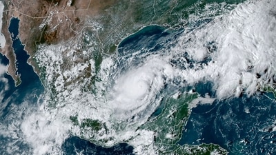 This handout satellite image courtesy of the National Oceanic and Atmospheric Administration (NOAA) and the Regional and Mesoscale Meteorology Branch (RAMMB) shows hurricane Milton churning over the Gulf of Mexico, on October 6, 2024. Storm Milton became a hurricane on October 6, the National Hurricane Center said, as it barrelled toward the western coast of Florida -- still recovering from the aftermath of devastating Hurricane Helene.
"Air Force hurricane hunters find Milton rapidly intensifying into a hurricane," the NHC said in an advisory, putting the storm's maximum sustained winds at 80 miles (130 kilometers) per hour, classifying it as a Category 1 hurricane.
It said the storm was some 815 miles from Tampa, Florida, and could arrive there by midweek as a major hurricane. (Photo by NOAA / AFP) / RESTRICTED TO EDITORIAL USE - MANDATORY CREDIT "AFP PHOTO / NOAA / RAMMB" - NO MARKETING NO ADVERTISING CAMPAIGNS - DISTRIBUTED AS A SERVICE TO CLIENTS (AFP) This handout satellite image courtesy of the National Oceanic and Atmospheric Administration (NOAA) and the Regional and Mesoscale Meteorology Branch (RAMMB) shows hurricane Milton churning over the Gulf of Mexico, on October 6, 2024. Storm Milton became a hurricane on October 6, the National Hurricane Center said, as it barrelled toward the western coast of Florida -- still recovering from the aftermath of devastating Hurricane Helene.
"Air Force hurricane hunters find Milton rapidly intensifying into a hurricane," the NHC said in an advisory, putting the storm's maximum sustained winds at 80 miles (130 kilometers) per hour, classifying it as a Category 1 hurricane.
It said the storm was some 815 miles from Tampa, Florida, and could arrive there by midweek as a major hurricane. (Photo by NOAA / AFP) / RESTRICTED TO EDITORIAL USE - MANDATORY CREDIT "AFP PHOTO / NOAA / RAMMB" - NO MARKETING NO ADVERTISING CAMPAIGNS - DISTRIBUTED AS A SERVICE TO CLIENTS (AFP)