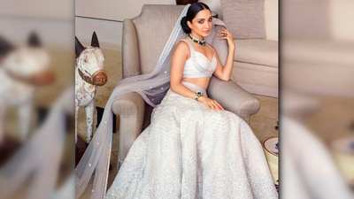 Kiara Advani looked drop-dead gorgeous in a white embellished lehenga. She accessorised her look with a stunning green necklace, a bracelet, and a ring, adding a pop of colour to her elegant ensemble. (Instagram/@kiaraaliaadvani) Kiara Advani looked drop-dead gorgeous in a white embellished lehenga. She accessorised her look with a stunning green necklace, a bracelet, and a ring, adding a pop of colour to her elegant ensemble. (Instagram/@kiaraaliaadvani)