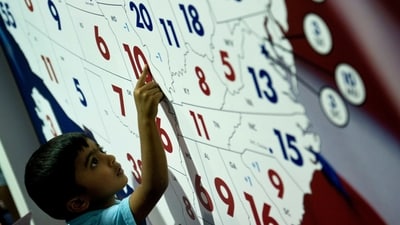 A boy points to US Presidential election electoral map at the American Presidential Experience exhibit (AFP) A boy points to US Presidential election electoral map at the American Presidential Experience exhibit (AFP)