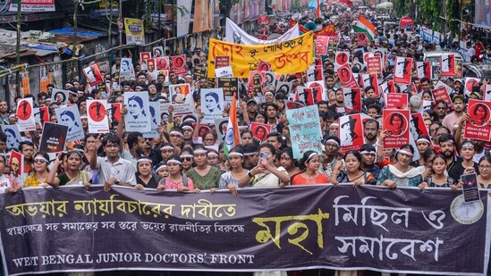 Junior doctors and others take out a protest march against the alleged sexual assault and murder of a postgraduate trainee doctor of the RG Kar Hospital, in Kolkata on Wednesday. (ANI Photo) (Saikat Paul )