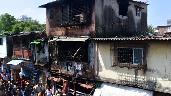 Siddharth Colony is part of a slum rehabilitation project that hit a roadblock at the consent stage in 2021. The narrow lanes of the slum made it difficult for the fire brigade to reach the area. The fire tenders had to be parked at a distance and the water hoses extended to carry out the firefighting operation from afar. (Bhushan Koyande/HT Photo)