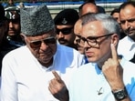 Jammu and Kashmir National Conference vice president and party candidate from Ganderbal and Budgam assembly seat Omar Abdullah with his father and party chief Farooq Abdullah. (ANI file)
