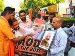 BJP supporters celebrate at BJP HQ after assembly election results in Delhi, on Tuesday. (HT Photo) BJP supporters celebrate at BJP HQ after assembly election results in Delhi, on Tuesday. (HT Photo)