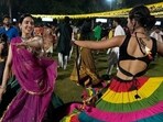 People wearing traditional attire perform Garba, a traditional dance of Gujarat state, during the Navratri festival. (Representative image) People wearing traditional attire perform Garba, a traditional dance of Gujarat state, during the Navratri festival. (Representative image)
