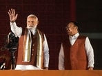Prime Minister Narendra Modi and Union Minister and BJP National President JP Nadda greet the gathering at the party headquarters after the declaration of results for the Haryana and Jammu and Kashmir Assembly elections, in New Delhi.