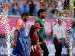 Pakistan batter Babar Azam, right, and India's captain Rohit Sharma.
