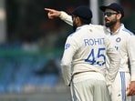 India's Virat Kohli (R) talks to captain Rohit Sharma during the fifth and final day of the second Test cricket match between India and Bangladesh. India's Virat Kohli (R) talks to captain Rohit Sharma during the fifth and final day of the second Test cricket match between India and Bangladesh.