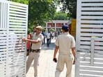 Security personnel guard outside the EVM strong room at the Government Girls College in Sector 14 counting centre on Sunday. (Parveen Kumar/HT Photo)