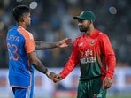 India's captain Suryakumar Yadav shakes hands with his Bangladesh's counterpart Najmul Hossain Shanto.