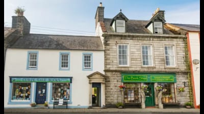 “Wigtown today has 15 bookshops, including Scotland’s largest second-hand book shop and the country’s only feminist book store. A walk down the high street, beginning from the Mercat Cross in the centre of town, showcases the multifaceted nature of these shops. “ (Photo courtesy: Visit Scotland.) “Wigtown today has 15 bookshops, including Scotland’s largest second-hand book shop and the country’s only feminist book store. A walk down the high street, beginning from the Mercat Cross in the centre of town, showcases the multifaceted nature of these shops. “ (Photo courtesy: Visit Scotland.)