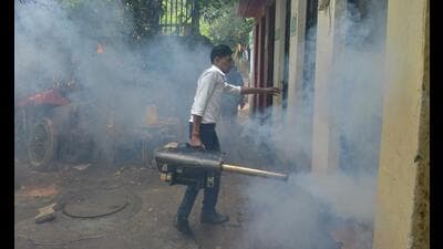 A New Delhi Municipal Council (NDMC) sanitation worker fumigates a slum area to reduce breeding sites for mosquitoes so as to prevent Dengue and other mosquito-borne tropical diseases, at Gole Market in New Delhi. (HT PHOTO) A New Delhi Municipal Council (NDMC) sanitation worker fumigates a slum area to reduce breeding sites for mosquitoes so as to prevent Dengue and other mosquito-borne tropical diseases, at Gole Market in New Delhi. (HT PHOTO)