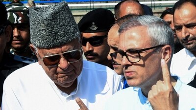 Jammu and Kashmir National Conference vice president and party candidate from Ganderbal and Budgam assembly seat Omar Abdullah with his father and party chief Farooq Abdullah. (ANI file) Jammu and Kashmir National Conference vice president and party candidate from Ganderbal and Budgam assembly seat Omar Abdullah with his father and party chief Farooq Abdullah. (ANI file)