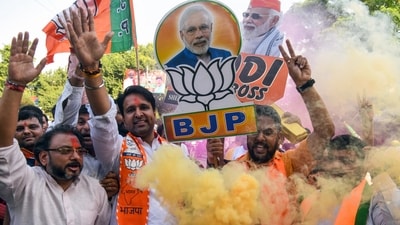 Bharatiya Janata Party (BJP) supporters celebrate the party's lead during the counting of votes for the Haryana Assembly elections, at BJP headquarters in New Delhi on Tuesday. (ANI/Amit Sharma )