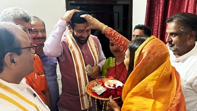 Haryana chief minister Nayab Singh Saini along with his wife Suman Saini being applied 'Tilak' after winning from the Ladwa seat in the Haryana Assembly election, in Kurukshetra on Tuesday.&nbsp; (BJP Haryana - X)