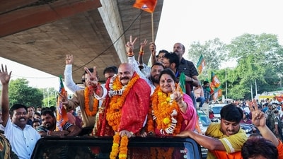 Yudhvir Sethi, the Bharatiya Janata Party (BJP) candidate from Jammu East, along with his wife Priya Sethi, displayed victory signs after his win in the Jammu and Kashmir Assembly elections on Tuesday. (ANI) Yudhvir Sethi, the Bharatiya Janata Party (BJP) candidate from Jammu East, along with his wife Priya Sethi, displayed victory signs after his win in the Jammu and Kashmir Assembly elections on Tuesday. (ANI)