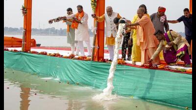 Chief minister Yogi Adityanath offering milk at Sangam as a ritual for the success of Mahakumbh Mela 2025 in Prayagraj on Sunday. (AP Photo) Chief minister Yogi Adityanath offering milk at Sangam as a ritual for the success of Mahakumbh Mela 2025 in Prayagraj on Sunday. (AP Photo)