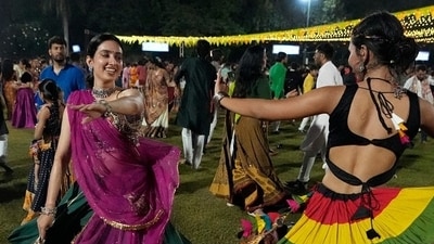 People wearing traditional attire perform Garba, a traditional dance of Gujarat state, during the Navratri festival. (Representative image) (AP) People wearing traditional attire perform Garba, a traditional dance of Gujarat state, during the Navratri festival. (Representative image) (AP)