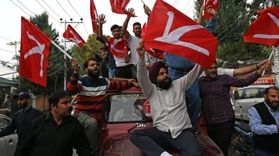 National Conference workers celebrate their party's victory in the Jammu and Kashmir elections in Srinagar on Tuesday. (Waseem Andrabi/HT Photo)