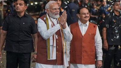 Prime Minister Narendra Modi greets the gathering upon his arrival at the party headquarters during an event after the declaration of results for the Haryana and Jammu and Kashmir Assembly elections, (PTI) (PTI) Prime Minister Narendra Modi greets the gathering upon his arrival at the party headquarters during an event after the declaration of results for the Haryana and Jammu and Kashmir Assembly elections, (PTI) (PTI)