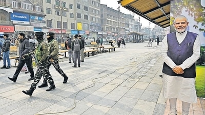 Soldiers walk past a cutout of Prime Minister Narendra Modi in Srinagar in 2023. (HT Archive) Soldiers walk past a cutout of Prime Minister Narendra Modi in Srinagar in 2023. (HT Archive)