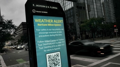 A weather alert is displayed along a sidewalk as Hurricane Milton churns in the Gulf of Mexico on October 07, 2024 in Tampa, Florida. Milton, which comes on heels of the destructive Hurricane Helene, has strengthened to a Category 5 storm. (Photo by SPENCER PLATT / GETTY IMAGES NORTH AMERICA / Getty Images via AFP) (Getty Images via AFP) A weather alert is displayed along a sidewalk as Hurricane Milton churns in the Gulf of Mexico on October 07, 2024 in Tampa, Florida. Milton, which comes on heels of the destructive Hurricane Helene, has strengthened to a Category 5 storm. (Photo by SPENCER PLATT / GETTY IMAGES NORTH AMERICA / Getty Images via AFP) (Getty Images via AFP)